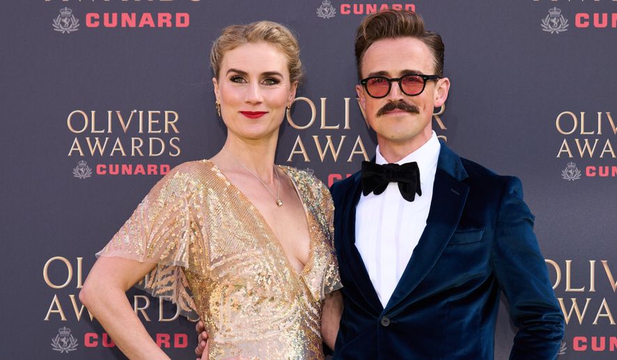Jessica Swale, left, and Tom Fletcher appear at the Olivier Awards in London on April 12, 2026. (Photo by Scott A Garfitt/Invision/AP, File)