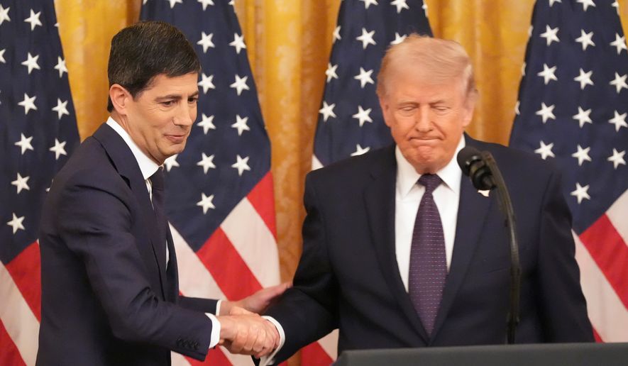 President Donald Trump, right, shakes the hand of Federal Reserve Chairman Kevin Warsh during Warsh's swearing-in in the East Room of the White House, Friday, May 22, 2026, in Washington. (AP Photo/Alex Brandon) ** FILE **