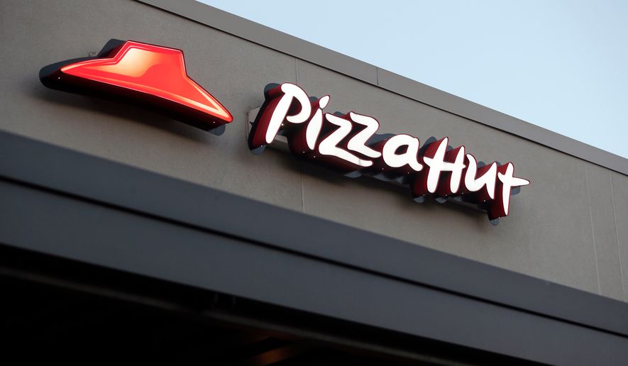 FILE - This Dec. 15, 2016, file photo shows a Pizza Hut restaurant in New Orleans. (AP Photo/Gerald Herbert, File)
