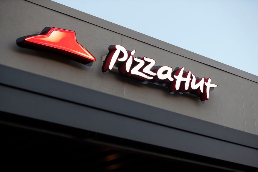 FILE - This Dec. 15, 2016, file photo shows a Pizza Hut restaurant in New Orleans. (AP Photo/Gerald Herbert, File)