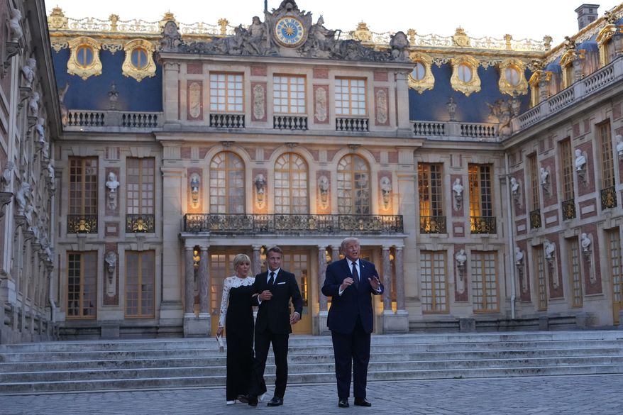 U.S. President Donald Trump is greeted by French President Emmanuel Macron and and first lady Brigitte Macron as he arrives at the Palace of Versailles, Wednesday, June 17, 2026, in Versailles, France. (AP Photo/Julia Demaree Nikhinson)