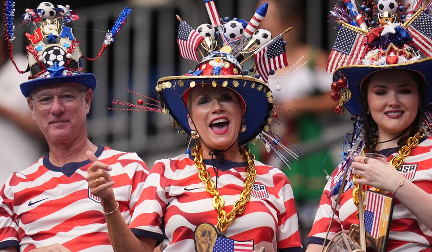 Fans wearing U.S.-themed clothing cheer before the World Cup Group E soccer match between Germany and Curacao in Houston, Sunday, June 14, 2026. (AP Photo/Eric Gay) CORRECTION: Removes country of fans