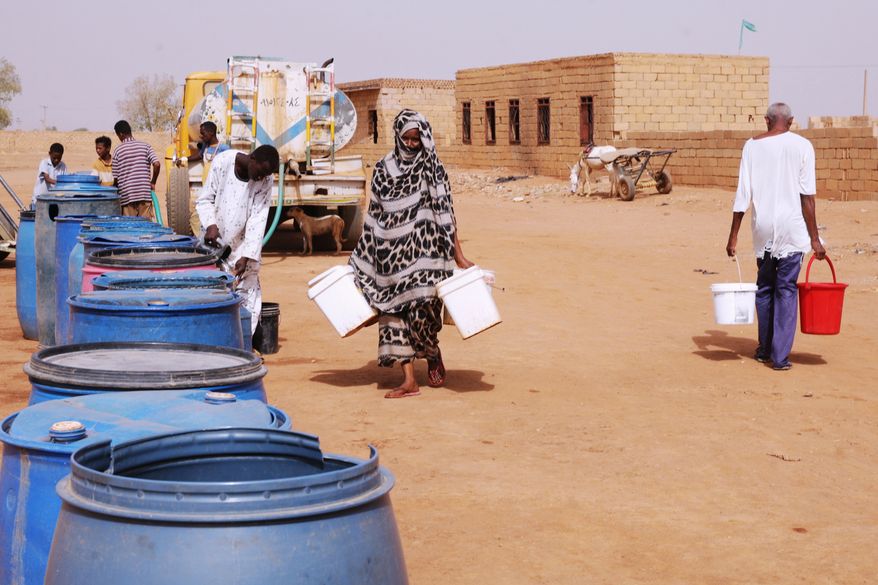 People fill water containers at a free distribution point amid water outages in Khartoum, Sudan, May 18, 2026. (AP Photo/Marwan Ali, File)