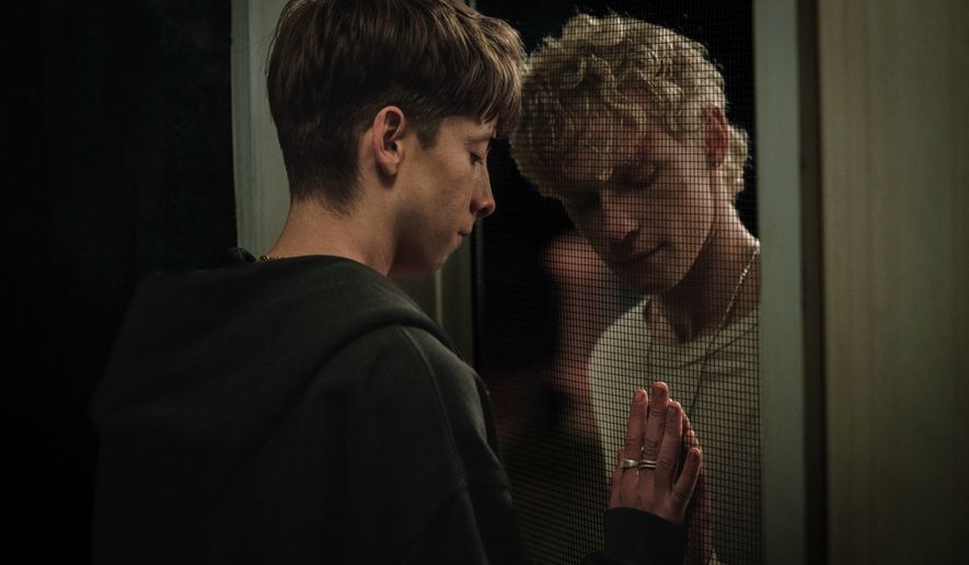 This image released by Neon shows Joe Bird, left, and Stacy Clausen in a scene from "Leviticus." (Neon via AP)