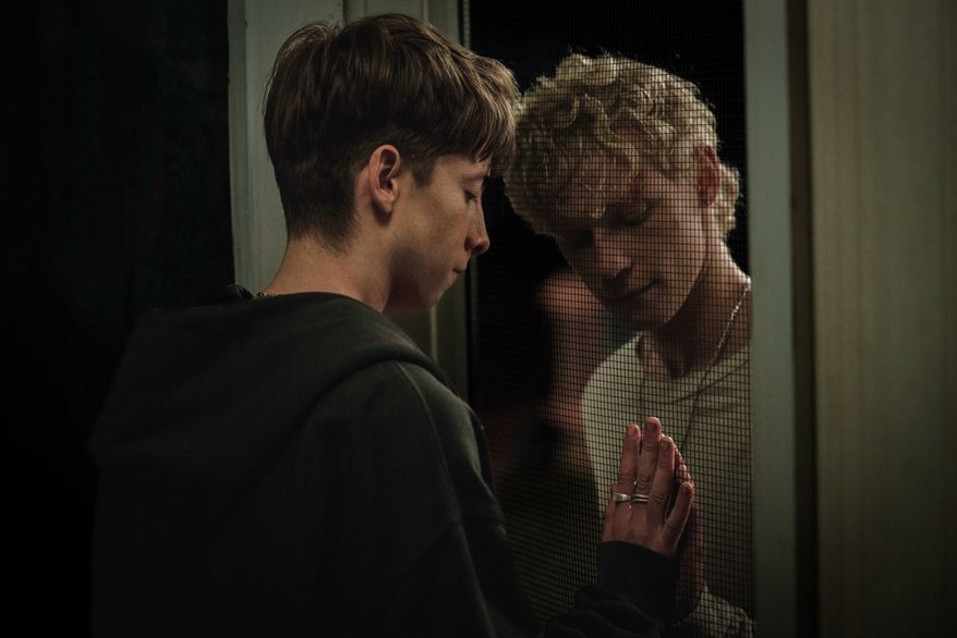 This image released by Neon shows Joe Bird, left, and Stacy Clausen in a scene from "Leviticus." (Neon via AP)