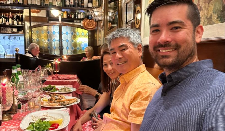 Roy Yamaguchi, founder of Roy’s Restaurants, center, appears with his son, Roy Jr., right, and Denise Yamaguchi at a restaurant in Venice on June 22, 2023. (Denise Yamaguchi via AP)