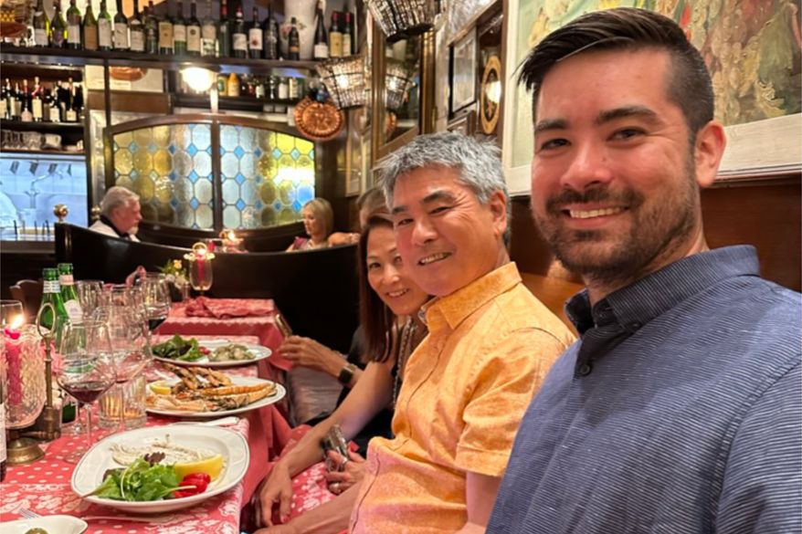 Roy Yamaguchi, founder of Roy’s Restaurants, center, appears with his son, Roy Jr., right, and Denise Yamaguchi at a restaurant in Venice on June 22, 2023. (Denise Yamaguchi via AP)