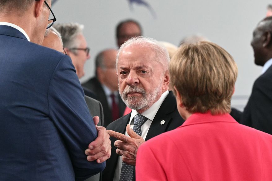 Brazil's President Luiz Inacio Lula da Silva, center, gestures as he speaks with Germany's Chancellor Friedrich Merz and IMF Managing Director Kristalina Georgieva, ahead of a working session at the G7 summit, in Evian-les-Bains, France, Wednesday, June 17, 2026. (Mandel Ngan/Pool Photo via AP)