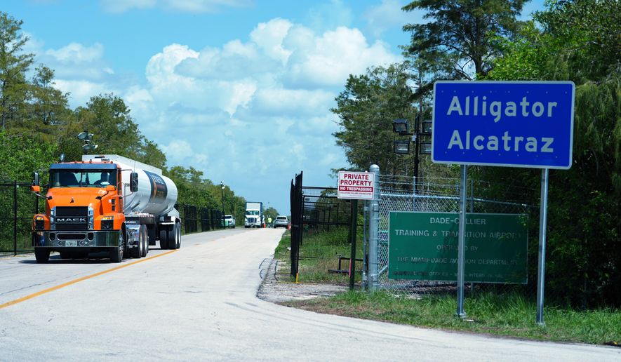 Trucks come and go from the "Alligator Alcatraz" immigration detention center in the Florida Everglades, Aug. 28, 2025, in Collier County, Fla. (AP Photo/Rebecca Blackwell, File)
