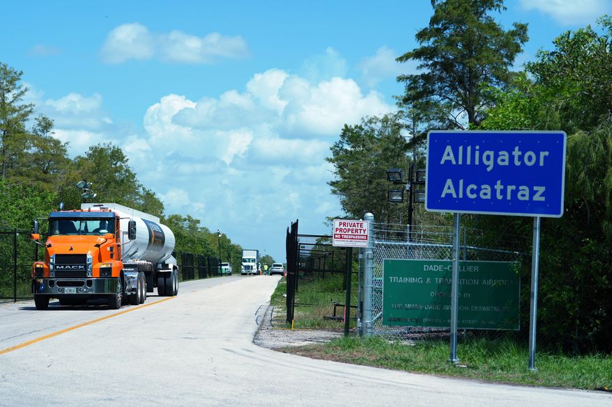 Trucks come and go from the "Alligator Alcatraz" immigration detention center in the Florida Everglades, Aug. 28, 2025, in Collier County, Fla. (AP Photo/Rebecca Blackwell, File)