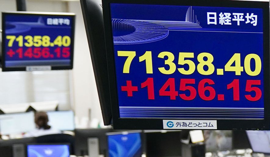 Electronic boards show Japan's benchmark Nikkei 225 index in Tokyo Thursday, June 18, 2026. (Kyodo News via AP)