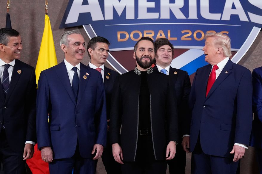 FILE - President Donald Trump poses for a group photo with, from left, Paraguay President Santiago Peña, Dominican Republic President Luis Abinader, Bolivia President Rodrigo Paz Pereira, El Salvador President Nayib Bukele, and Argentina President Javier Milei, at the Shield of the Americas Summit at Trump National Doral Miami in Doral, Fla., March 7, 2026. (AP Photo/Mark Schiefelbein, File)