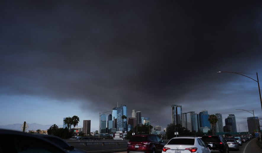 The sky is filled with smoke from a warehouse fire in Los Angeles on Wednesday, June 17, 2026. (AP Photo/Jae C. Hong)