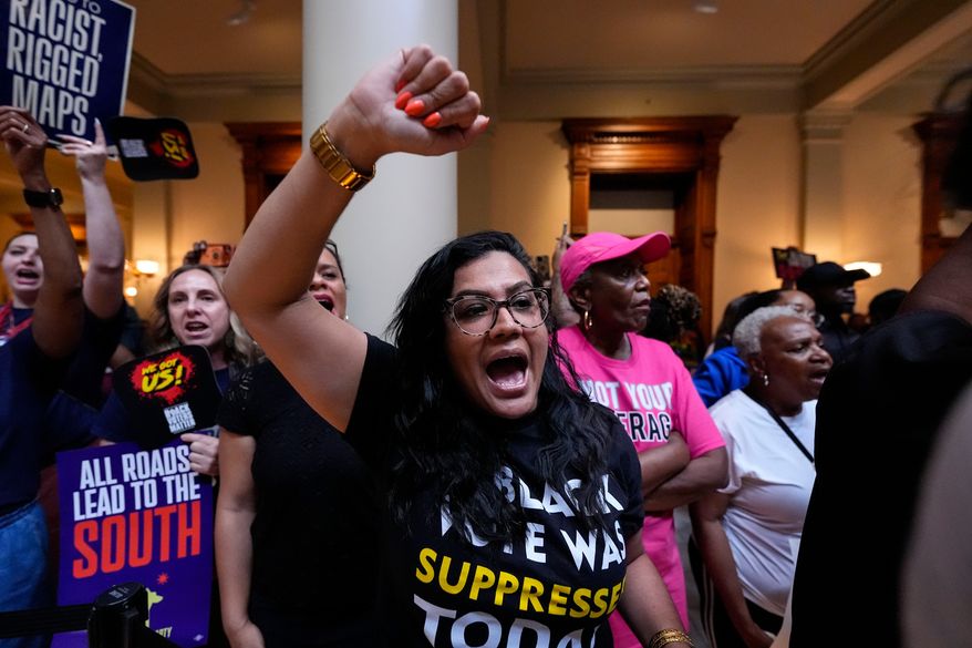 People listen and cheer as lawmakers speak about redistricting during a special legislative session at the state capitol, Wednesday, June 17, 2026, in Atlanta. (AP Photo/Mike Stewart)