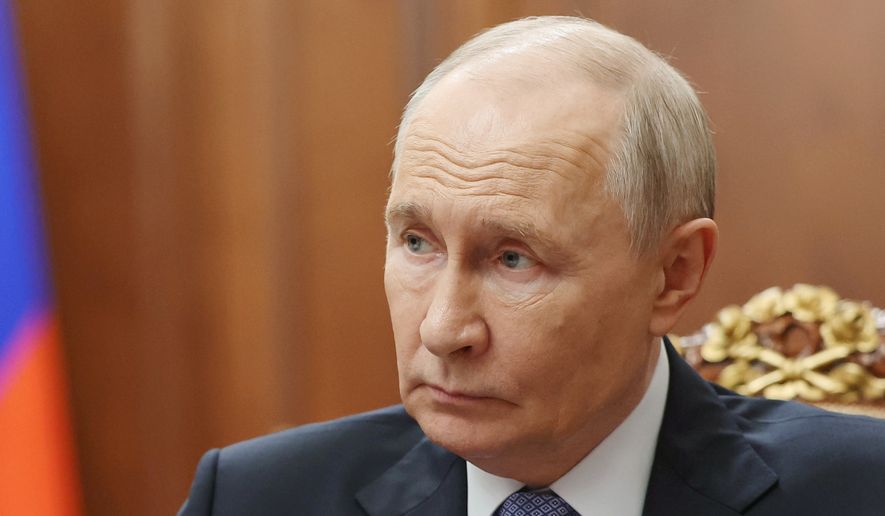 Russian President Vladimir Putin speaks with Sergei Menyailo, the North Ossetia-Alania Republic Head, during their meeting at the Kremlin in Moscow, Tuesday, June 16, 2026. (Vyacheslav Prokofyev, Sputnik, Kremlin Pool Photo via AP)