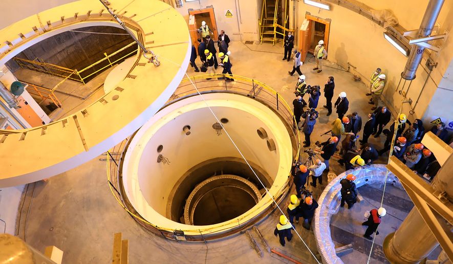 FILE - In this photo released by the Atomic Energy Organization of Iran, technicians work at the Arak heavy water reactor's secondary circuit as officials and media visit the site near Arak, Iran, Dec. 23, 2019. (Atomic Energy Organization of Iran via AP, File)