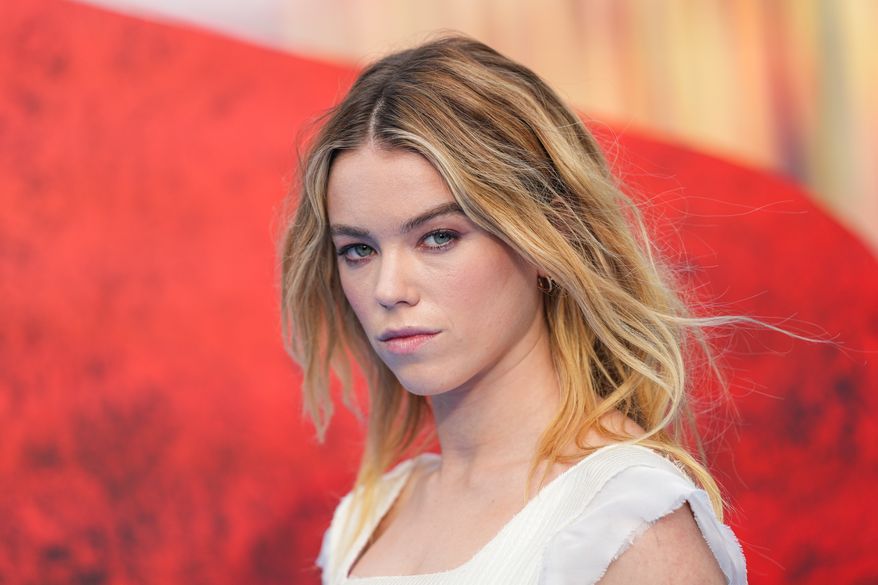 Milly Alcock poses for photographers upon arrival at a fan event for the film 'Supergirl' on Thursday, June 18, 2026, in London. (Photo by Scott A Garfitt//Invision/AP)