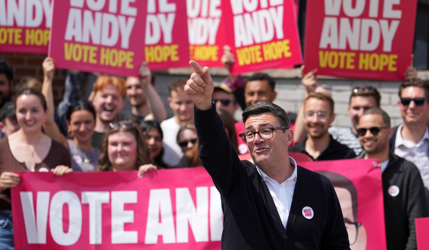 Andy Burnham, Britain's Labour candidate for Makerfield, gestures in front of supporters during the by-election in Makerfield, England, Thursday, June 18, 2026 where voters are choosing a new lawmaker with Andy Burnham of the Labour Party as the leading contender.(AP Photo/Jon Super)
