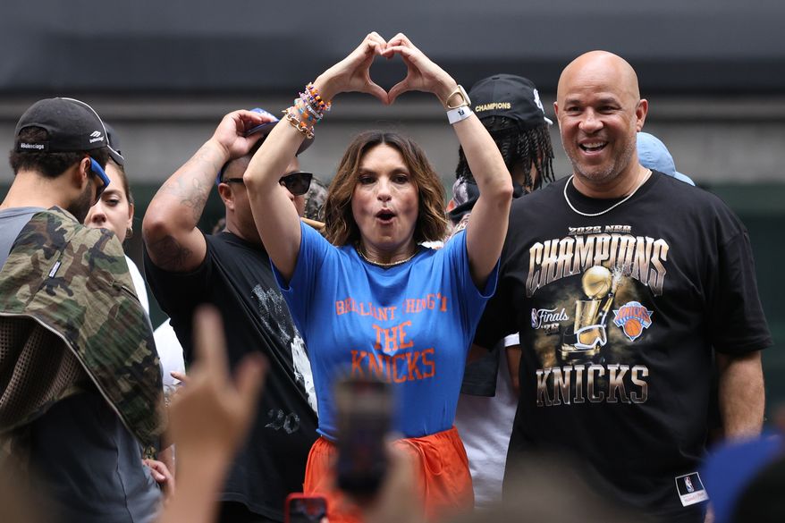 Mariska Hargitay, center, celebrates during the New York Knicks' NBA championship parade Thursday, June 18, 2026, in New York. (AP Photo/Heather Khalifa)