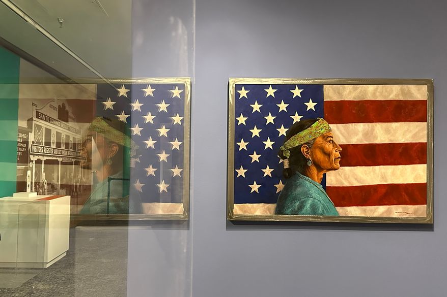 A painting by Navajo artist Kee Yazzie is displayed as part of the "Stars, Stripes and First Americans" exhibition at the Museum of Indian Arts and Culture in Santa Fe, N.M., on Monday, May 11, 2026. (AP Photo/Susan Montoya Bryan)