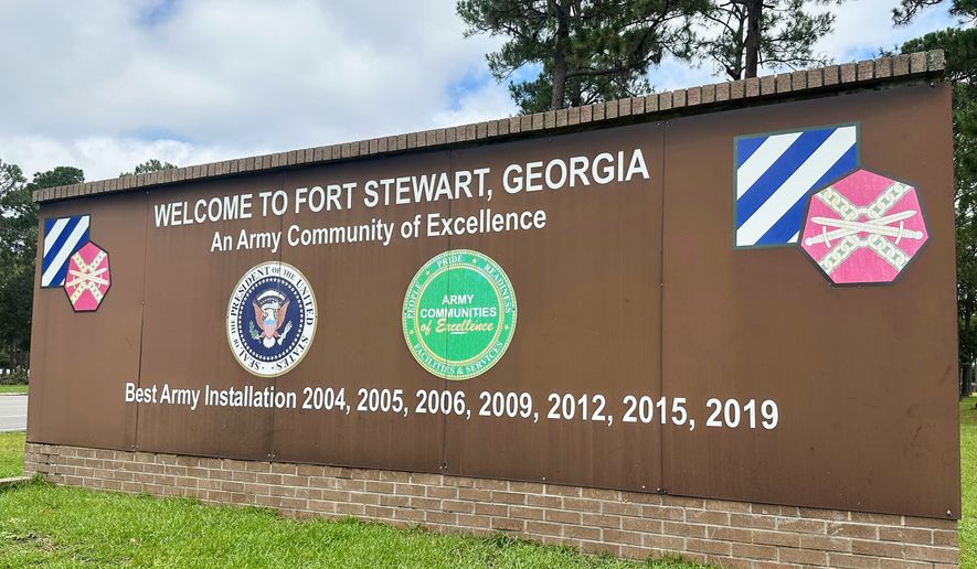 FILE - A sign stands outside the main gate of Fort Stewart, Georgia, on Wednesday, Aug. 6, 2025. (AP Photo/Russ Bynum, File)