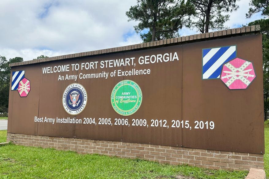 FILE - A sign stands outside the main gate of Fort Stewart, Georgia, on Wednesday, Aug. 6, 2025. (AP Photo/Russ Bynum, File)