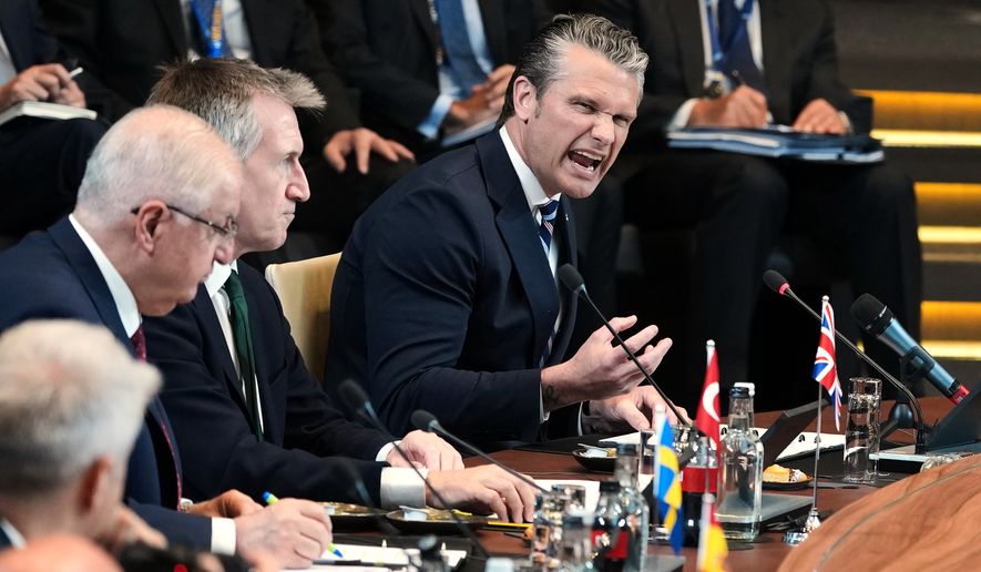 United States Defense Secretary Pete Hegseth, right, speaks during a meeting of the North Atlantic Council in defense ministers format at NATO headquarters in Brussels, Thursday, June 18, 2026. (AP Photo/Virginia Mayo)