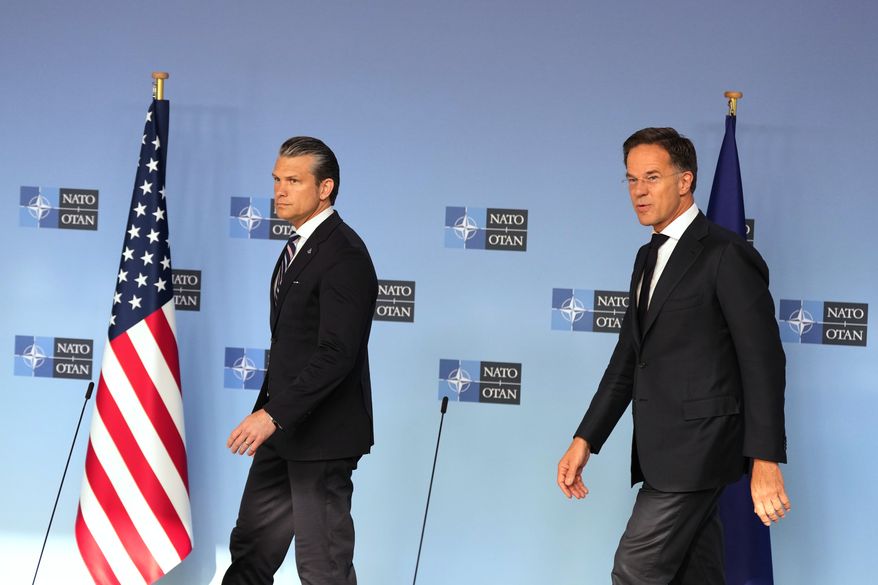 United States Defense Secretary Pete Hegseth, left, and NATO Secretary General Mark Rutte arrive for a media conference during a meeting of NATO defense ministers at NATO headquarters in Brussels, Thursday, June 18, 2026. (AP Photo/Virginia Mayo)