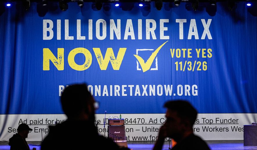 FILE - A large banner is seen at a campaign event for a proposed "billionaires tax" in Los Angeles on Feb. 18, 2026. (AP Photo/Jae C. Hong, File)