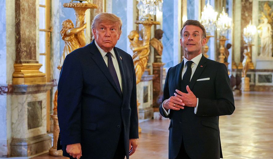 U.S. President Donald Trump, left, receives a tour of Chateau de Versailles from President Emmanuel Macron ahead of a dinner on Wednesday, June 17, 2026 in Versailles, France, after the G7 summit in Evian, France. (Anna Moneymaker/Pool Photo via AP)