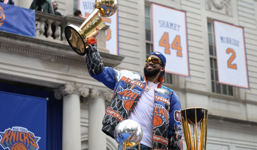 New York Knicks center Karl-Anthony Towns celebrates during the New York Knicks' NBA championship parade Thursday, June 18, 2026, in New York. (AP Photo/Heather Khalifa)