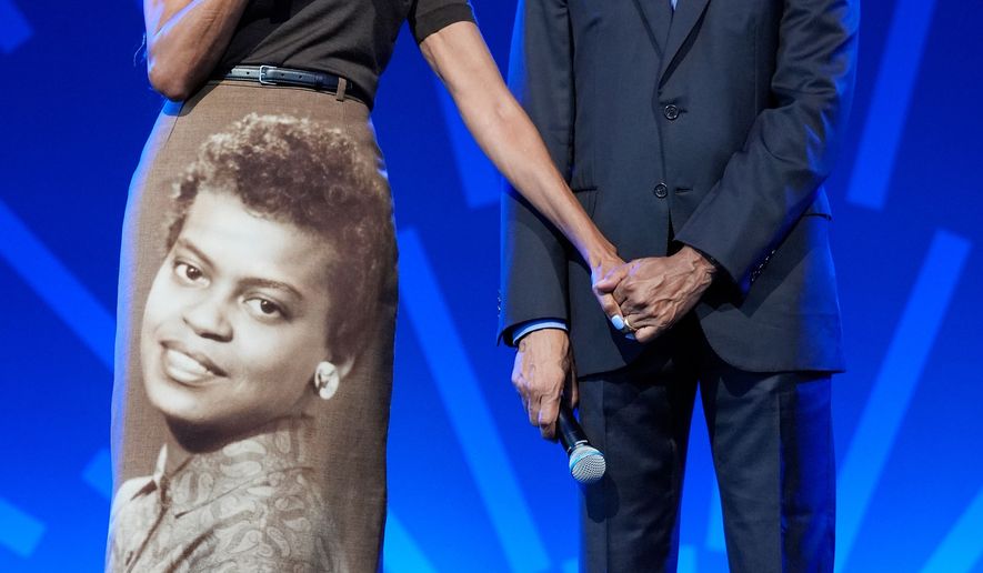 Former President Barack Obama stands on stage with former first lady Michelle Obama at a stakeholders event at the Obama Presidential Center, Tuesday, June 16, 2026, in Chicago. (AP Photo/Pablo Martinez Monsivais, Pool)