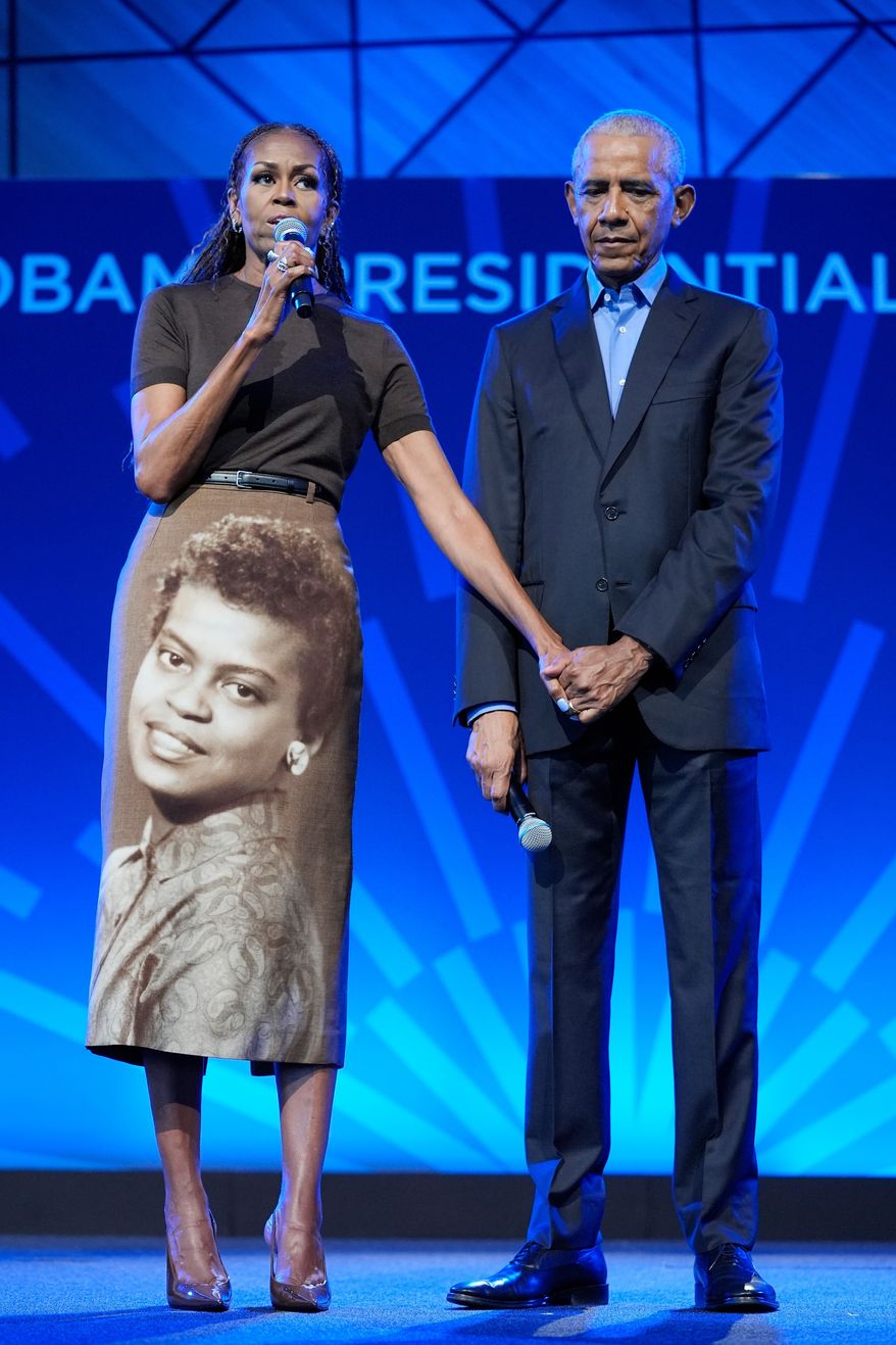 Former President Barack Obama stands on stage with former first lady Michelle Obama at a stakeholders event at the Obama Presidential Center, Tuesday, June 16, 2026, in Chicago. (AP Photo/Pablo Martinez Monsivais, Pool)