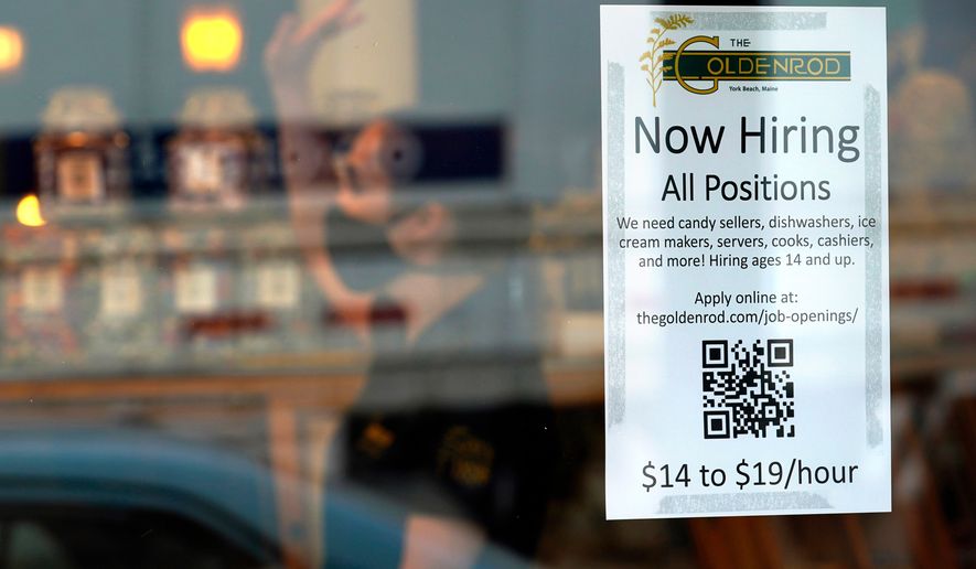 FILE - A sign advertises for help The Goldenrod, a popular restaurant and candy shop, Wednesday, June 1, 2022, in York Beach, Maine. (AP Photo/Robert F. Bukaty, File)