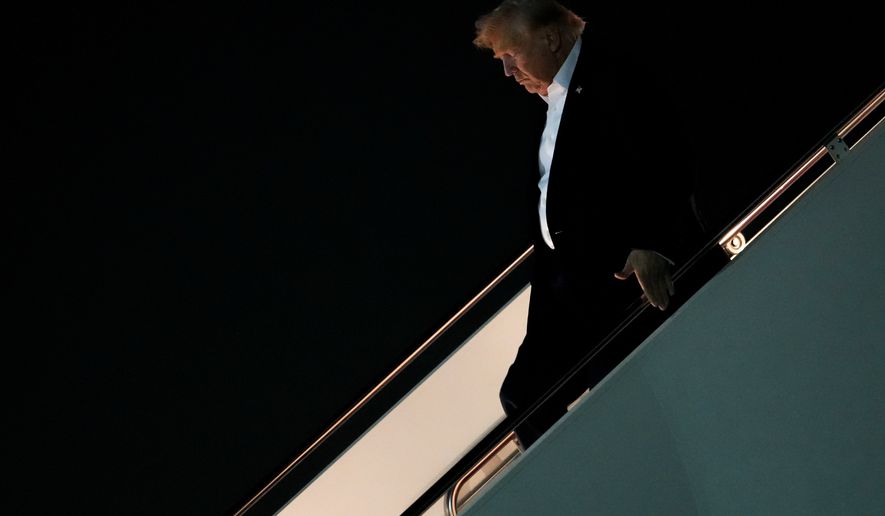 President Donald Trump disembarks Air Force One after attending the G7 summit in France, Thursday, June 18, 2026, at Joint Base Andrews, Md. (AP Photo/Julia Demaree Nikhinson)