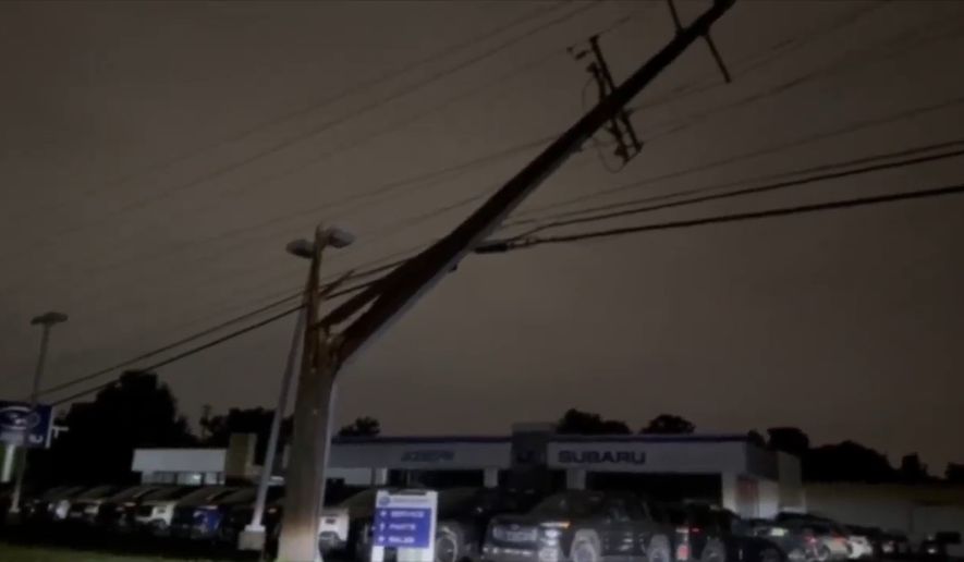 This grab from a video shot by WCPO-TV shows an electricity pole damaged by the storm, on Thursday, June 18, 2026, in Florence, Kentucky. (WCPO-TV via AP)