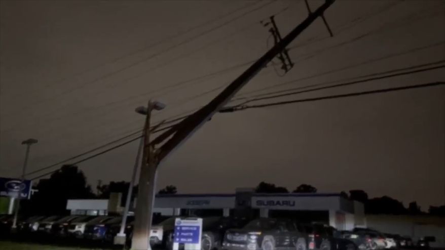 This grab from a video shot by WCPO-TV shows an electricity pole damaged by the storm, on Thursday, June 18, 2026, in Florence, Kentucky. (WCPO-TV via AP)