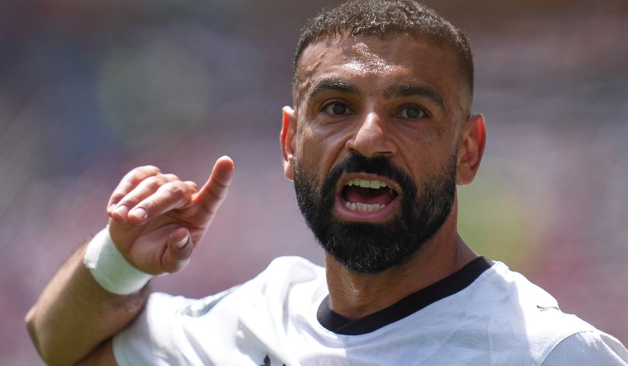 Egypt's Mohamed Salah gestures as he speaks to his teammates during the World Cup Group G soccer match between Belgium and Egypt in Seattle, Monday, June 15, 2026. (AP Photo/Manu Fernandez, File)