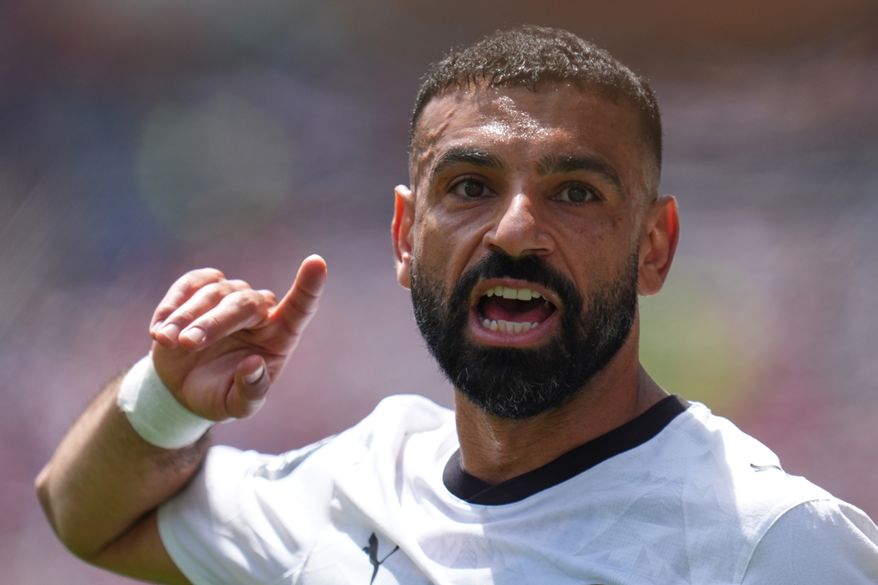 Egypt's Mohamed Salah gestures as he speaks to his teammates during the World Cup Group G soccer match between Belgium and Egypt in Seattle, Monday, June 15, 2026. (AP Photo/Manu Fernandez, File)