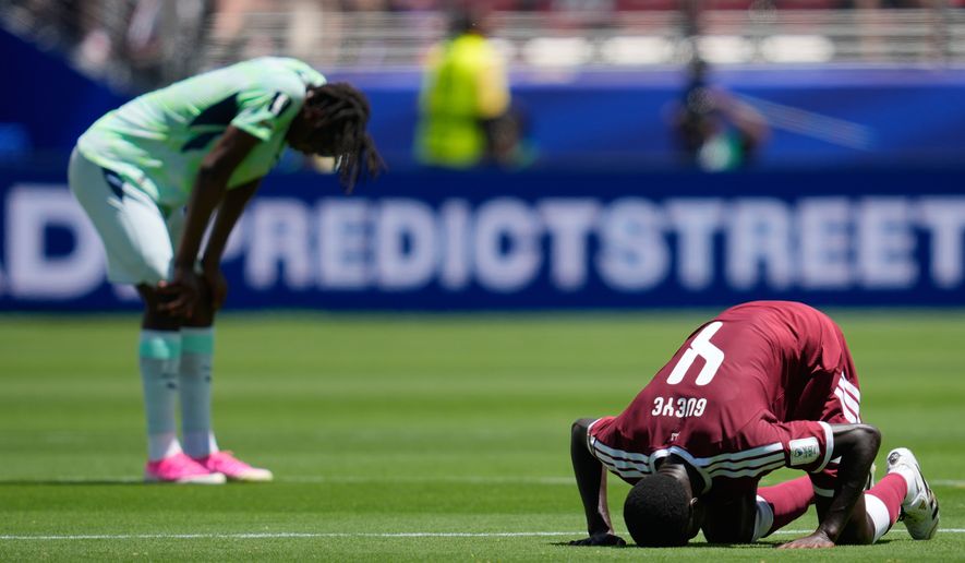 Qatar's Issa Laye prays after the World Cup Group B soccer match between Qatar and Switzerland in Santa Clara, Calif., June 13, 2026. (AP Photo/Eugene Hoshiko, File)