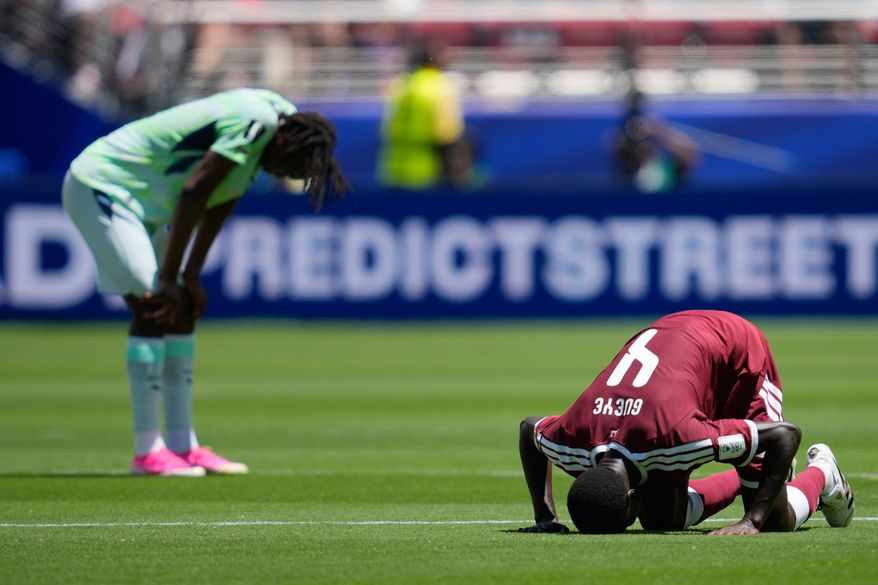 Qatar's Issa Laye prays after the World Cup Group B soccer match between Qatar and Switzerland in Santa Clara, Calif., June 13, 2026. (AP Photo/Eugene Hoshiko, File)