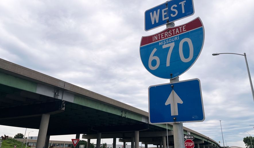 A sign for I-670 is seen near the site of a shooting Thursday, June 18, 2026, in Kansas City, Mo. (AP Photo/Heather Hollingsworth)