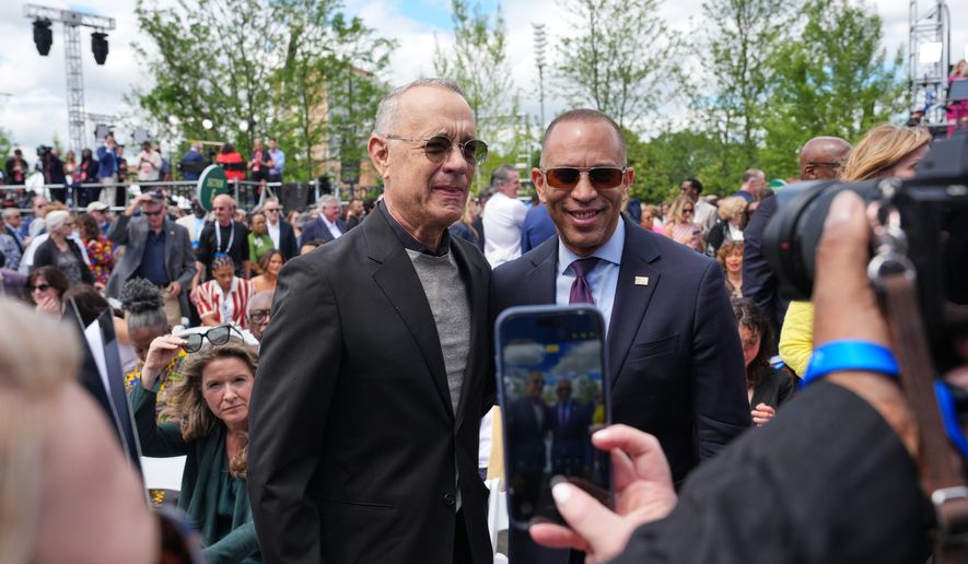 Tom Hanks, left, and House Minority Leader Hakeem Jeffries, D-N.Y., pose for a photo ahead of the Obama Presidential Center dedication ceremony Thursday, June 18, 2026, in Chicago. (AP Photo/Alex Brandon)