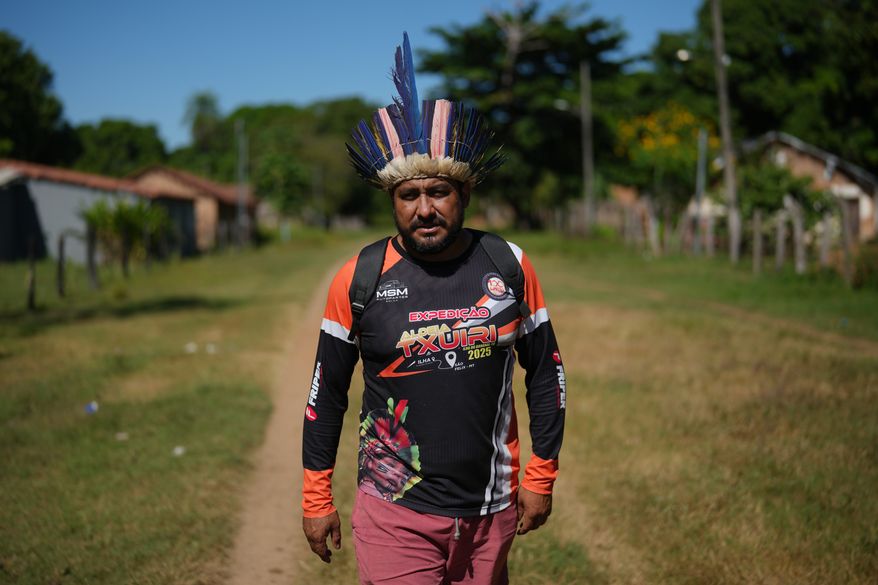 Indigenous chief Cleiton Javae walks in his community at the Txuiri village on Bananal Island in Formoso do Araguaia, Tocantins state, Brazil, Thursday, May 21, 2026. (AP Photo/Andre Penner)