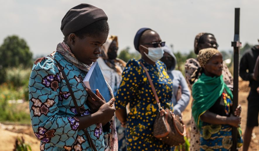 Catholic nuns from the orphanage where Vanisa Anifa, a 6-month-old orphaned girl who died of Ebola, was staying, attends her funeral in Bunia, Congo, Friday, June 19, 2026. (AP Photo/Moses Sawasawa)