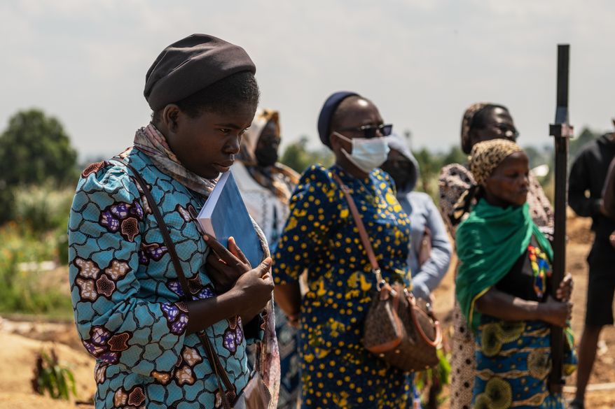 Catholic nuns from the orphanage where Vanisa Anifa, a 6-month-old orphaned girl who died of Ebola, was staying, attends her funeral in Bunia, Congo, Friday, June 19, 2026. (AP Photo/Moses Sawasawa)