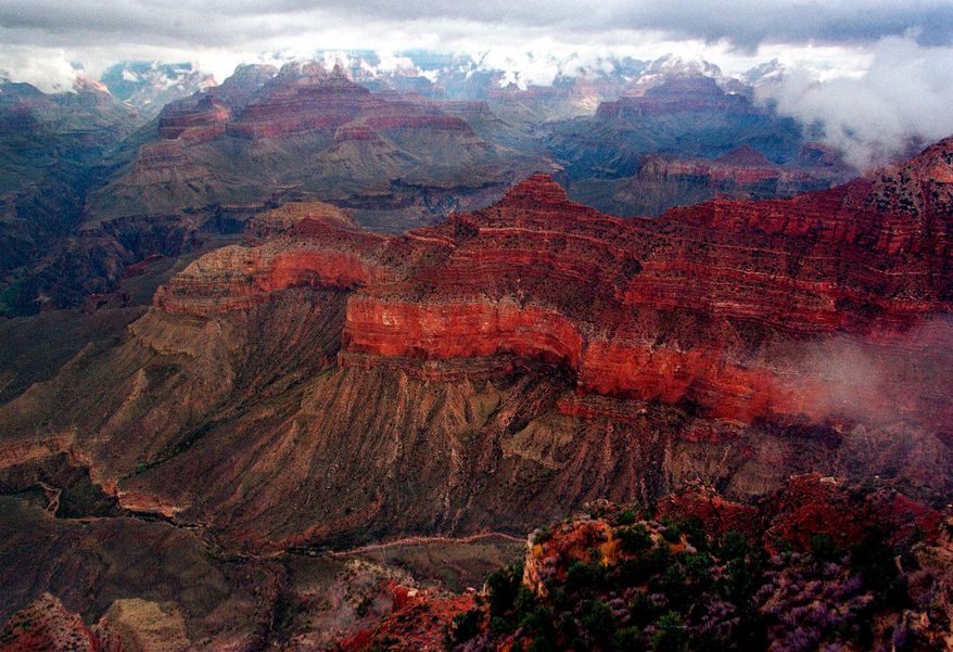 The Kaibab Trail, running right to left at center, at Grand Canyon National Park on Jan. 20, 2001. (AP Photo/Matt York, File)