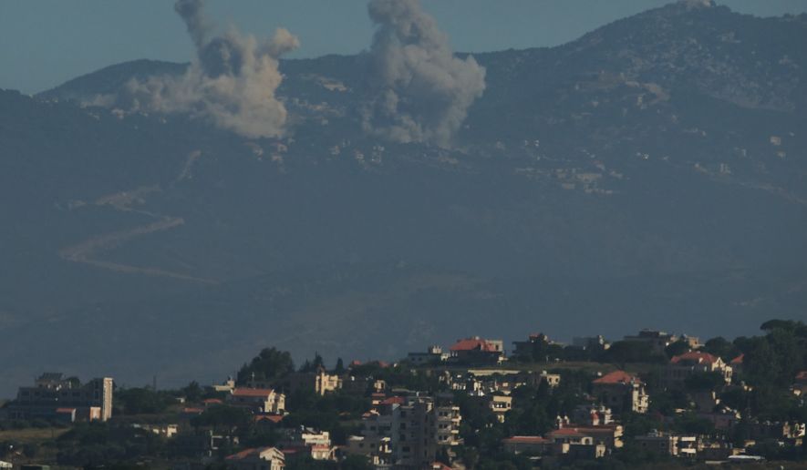 Smokes rise to the sky following an Israeli military strike in southern Lebanon as seen from northern Israel, Friday, June 19, 2026. (AP Photo/Leo Correa)