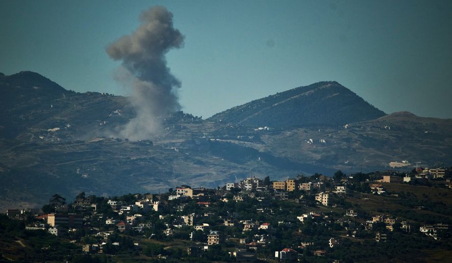 Smoke rises to the sky following an Israeli military strike in southern Lebanon as seen from northern Israel, Friday, June 19, 2026. (AP Photo/Leo Correa)