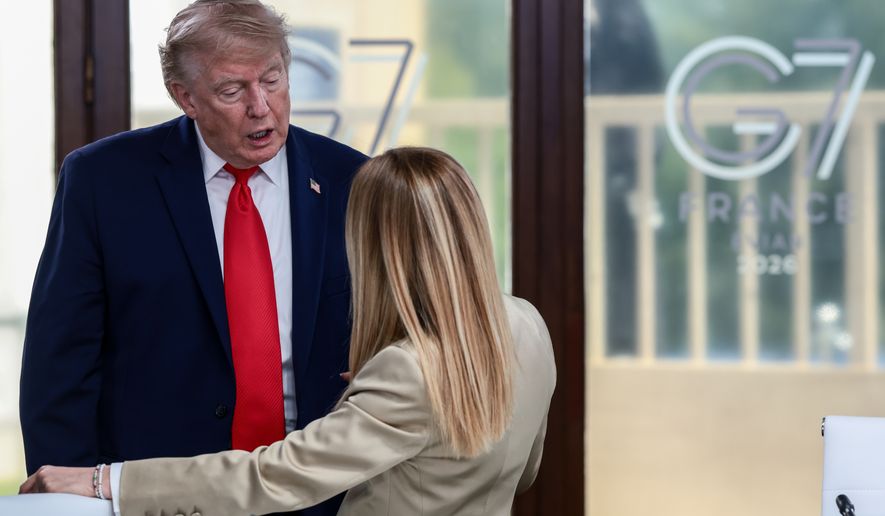 President Donald Trump speaks with Italian Prime Minister Giorgia Meloni at a working lunch with leaders of G7 and the Middle East in Evian-les-Bains, France, Tuesday, June 16, 2026. (Evelyn Hockstein/Pool Photo via AP)